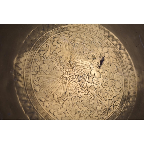 140 - A Circular Brass Charger/Tray, Probably Indian with Engraved Decoration depicting Gothic Bird, 47cms... 