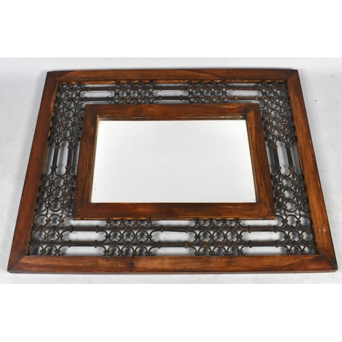 177 - A Far Eastern Wooden and Wrought Iron Rectangular Wall Mirror, 100cms by 80cms