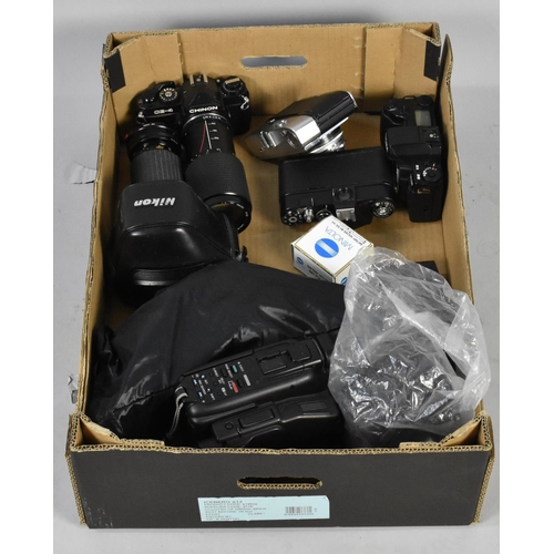 204 - A Box Containing Various Camera Bodies, Telescopic Lenses and Other Camera Accessories