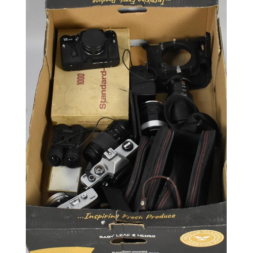 207 - A Box Containing Various Camera Bodies, Telescopic Lenses and Other Camera Accessories