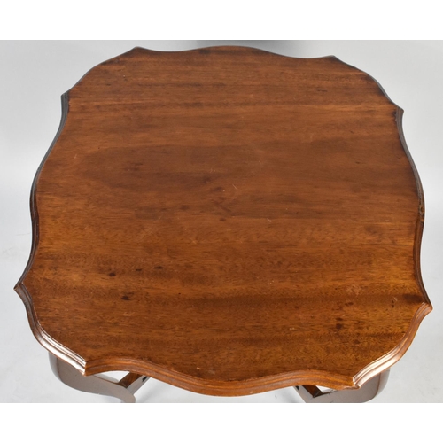 212 - An Edwardian Mahogany Shaped Top Occasional Table on Extended Cabriole Supports, 58cms Square