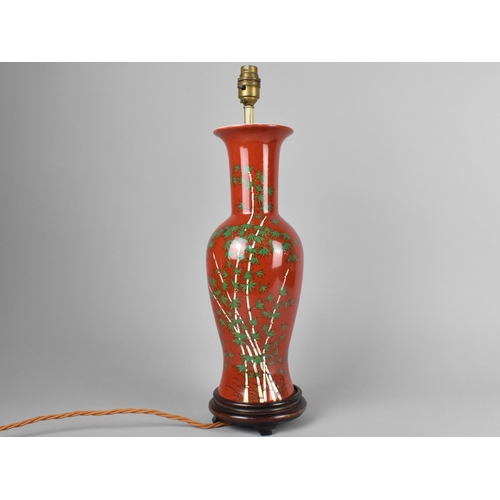 233 - A Porcelain Red Glazed Baluster Vase Decorated with Bamboo Branches, Now Converted to Table Lamp, Wo... 