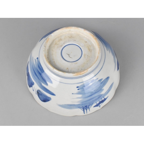 237 - A Qing Period Chinese Blue and White Bowl of Lobed Form Decorated with River Village Scene, Having H... 