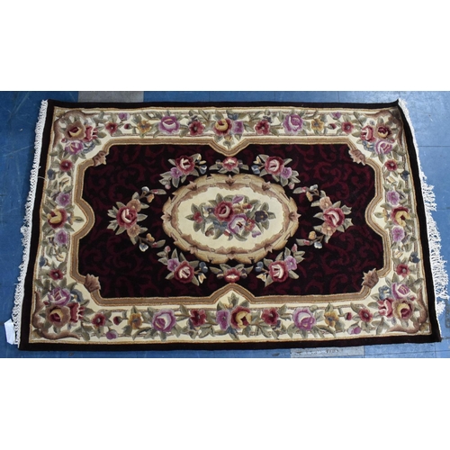 505 - A Chinese Patterned Rug on Burgundy Ground, 166x107cms