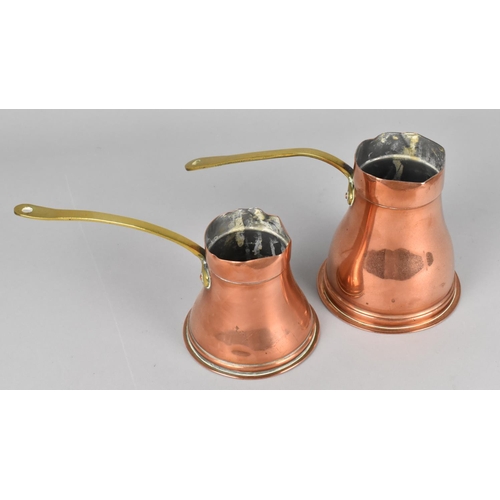 67 - Two Graduated Copper Side Pouring Jugs with Brass Handles