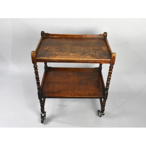 69 - A Mid 20th Century Oak Two Tier Galleried Trolley with Bobbin Supports, 60cms Wide