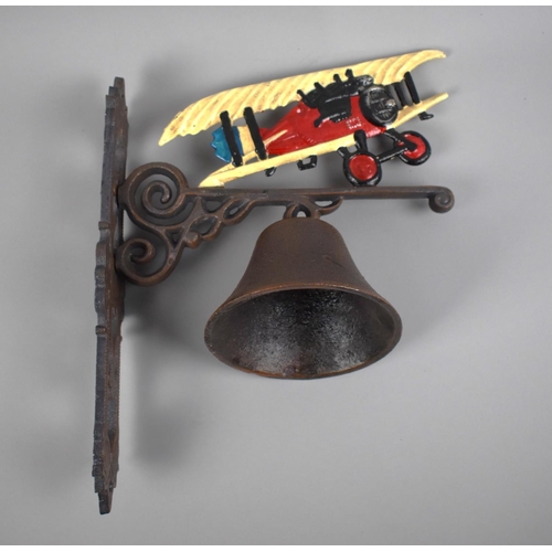 115 - A Cast Metal Wall Hanging Bell with Bi-Plane Motif, 27x33cms High, Plus VAT