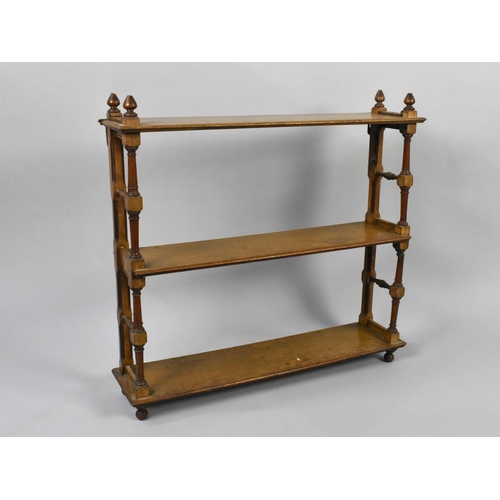 161 - A Late Victorian Three Tier Mahogany Free Standing Bookcase with Turned Supports and Vase Finials, 7... 