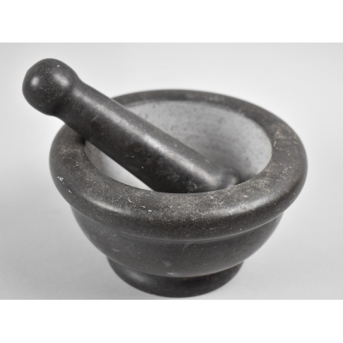 165 - A Stone Pestle and Mortar