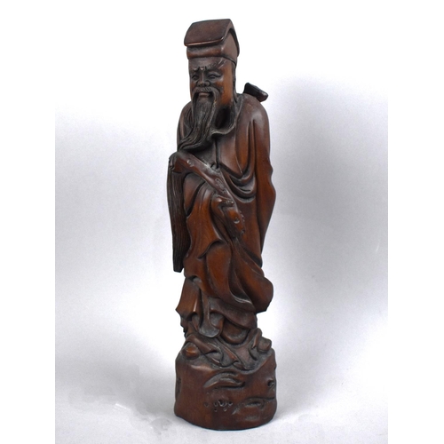 166 - A Reproduction Chinese Carved Wooden Study of Immortal, 38cms High