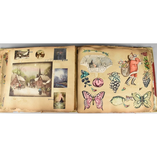 183 - An Early 20th Century Scrapbook Containing Various Cut Outs to include Louis Wain Type Cats, Cartoon... 