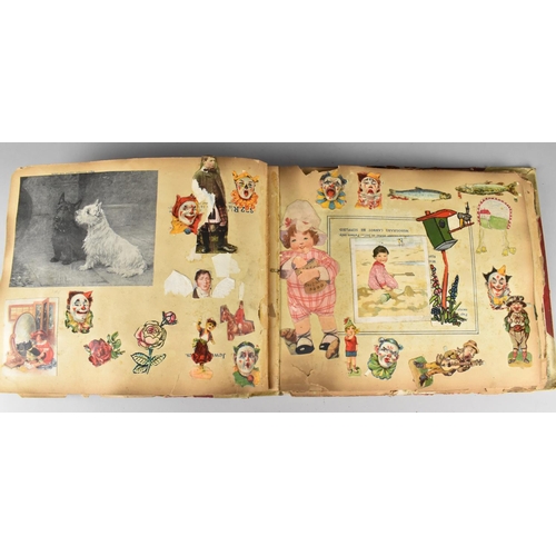 183 - An Early 20th Century Scrapbook Containing Various Cut Outs to include Louis Wain Type Cats, Cartoon... 