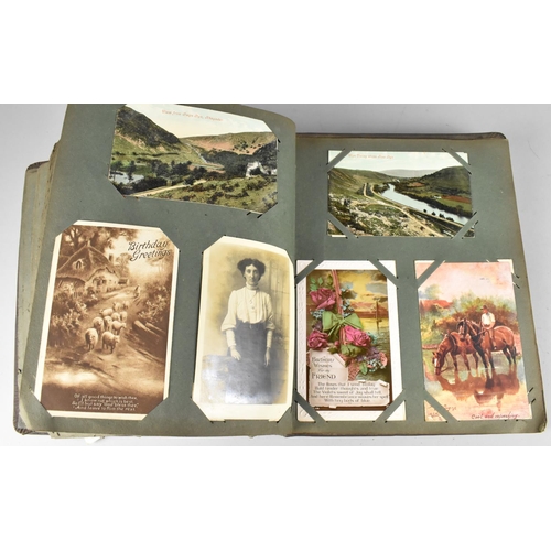 188 - An Edwardian Postcard Album Containing 290+ Postcards, Including Buildings, Risque, People, Flowers ... 