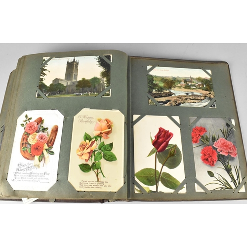 188 - An Edwardian Postcard Album Containing 290+ Postcards, Including Buildings, Risque, People, Flowers ... 