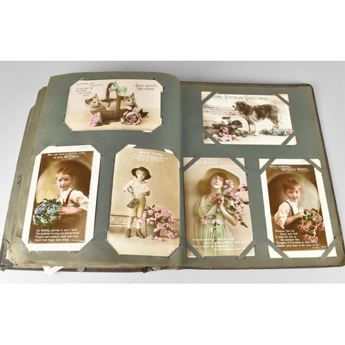 188 - An Edwardian Postcard Album Containing 290+ Postcards, Including Buildings, Risque, People, Flowers ... 