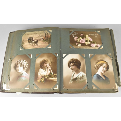 188 - An Edwardian Postcard Album Containing 290+ Postcards, Including Buildings, Risque, People, Flowers ... 