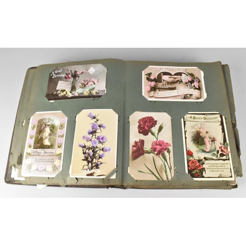 188 - An Edwardian Postcard Album Containing 290+ Postcards, Including Buildings, Risque, People, Flowers ... 