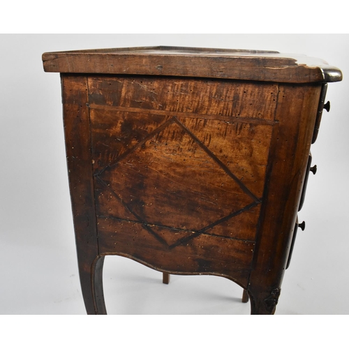 24 - A Continental Three Drawer Bedside with Galleried Back having Carved Floral Decoration, Four Cabriol... 