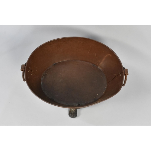 279 - A Cast Metal Foot Bath with Twin Ring Handles on Four Claw Feet, 58cms Wide