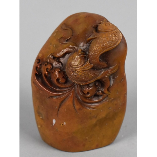 296 - A Reproduction Chinese Soapstone Effect Seal, Carved with Fish, 7cms High