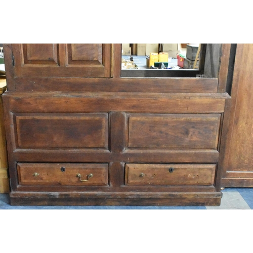 524 - A 18th/19th Century Oak Livery Cupboard, Having Moulded Corners Over a Pair of Paneled Covered Doors... 