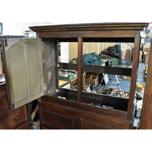 524 - A 18th/19th Century Oak Livery Cupboard, Having Moulded Corners Over a Pair of Paneled Covered Doors... 