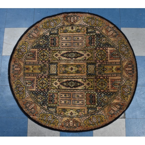 545 - A Patterned Circular Rug, 120x126cms