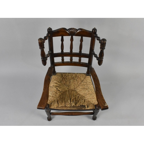 549 - A 19th Century Childs Ash and Elm Rush Seated Wing Back Kitchen Chair with Spindle Back and Front Su... 