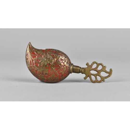 73 - An Indian Red Enamel on Brass Perfume Bottle, 7cms Long