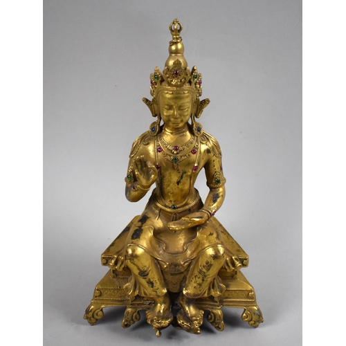 79 - A Reproduction Gilt Bronze Study of Buddha Seated On Throne, 24cms High