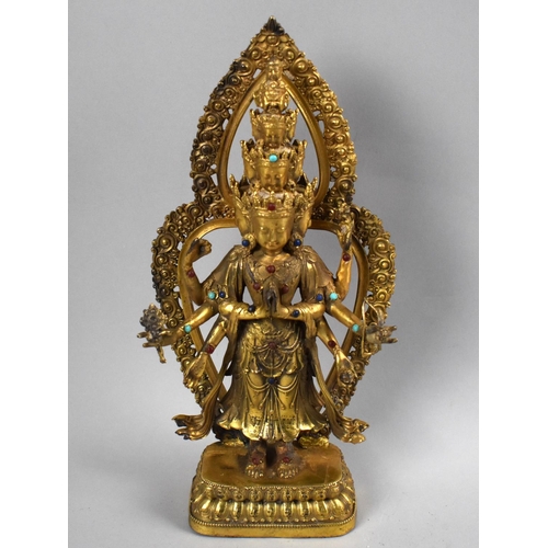 80 - A Reproduction Tibetan Gilt Bronze and Jewelled Study of Buddha, 28cms High