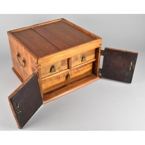 83 - A Chinese Camphor Wood Travelling Chest, Two Door Front Revealing Two Short and One Long Drawer, Met... 