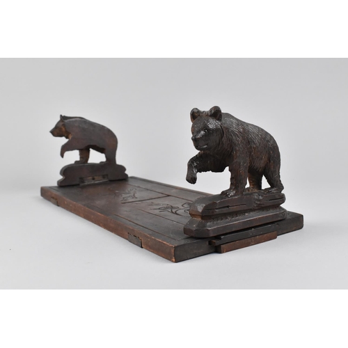 A Pair of Black Forest Type Folding Bookends with Bear Supports