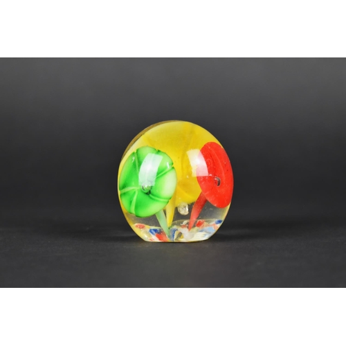 438 - A Small Glass Paperweight Decorated with Flowers, 4.5cms High