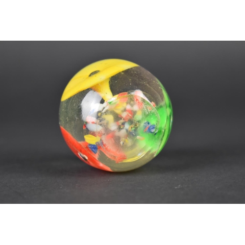 438 - A Small Glass Paperweight Decorated with Flowers, 4.5cms High