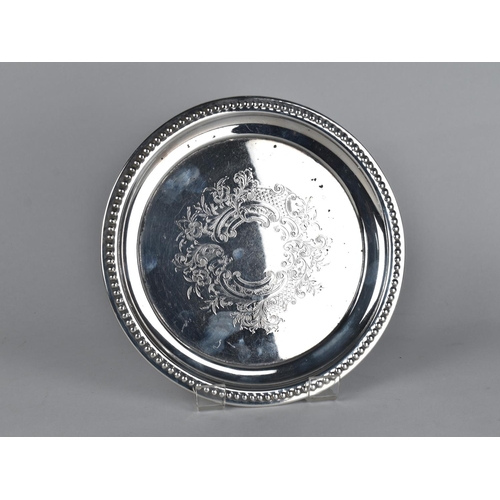 101 - A Silver Plate Circular Card Tray with Scrolled Floral Decoration and Beaded Trim, 20.5cms Diameter