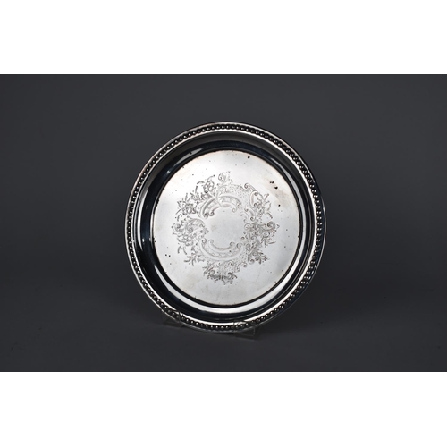 101 - A Silver Plate Circular Card Tray with Scrolled Floral Decoration and Beaded Trim, 20.5cms Diameter