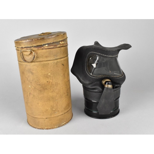 113 - A WWII Period Gas Mask in Canister with Fragment of Newspaper Page Inside Dated 1939