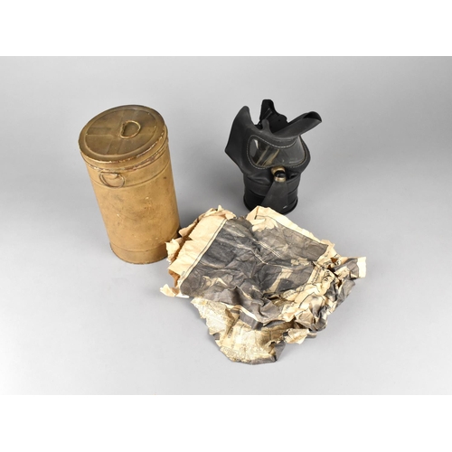 113 - A WWII Period Gas Mask in Canister with Fragment of Newspaper Page Inside Dated 1939