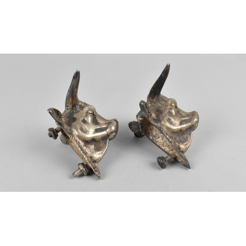 122 - A Pair of Metal Mounts/Candles in the Form of Bulls Heads, 9x8cms High