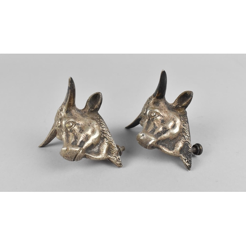 122 - A Pair of Metal Mounts/Candles in the Form of Bulls Heads, 9x8cms High