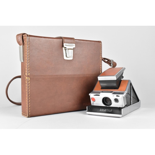 205 - A Polaroid Land Camera Outfit in Fitted Leather Case, Polaroid Tripod Mount, Various Other Accessori... 