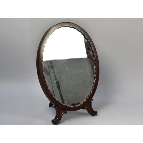 227 - A Victorian Mahogany Framed Oval Easel Back Mirror, 54cms High