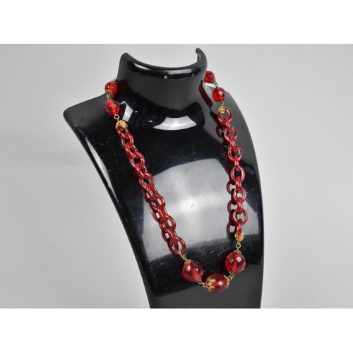 272 - A Vintage Glass Necklace with Faceted Red Beads and Chain Glass Links