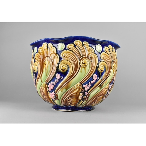 338 - A Large Majolica Jardiniere Decorated in Relief with Scrolls etc, 29cm high and 36cm Diameter (Some ... 