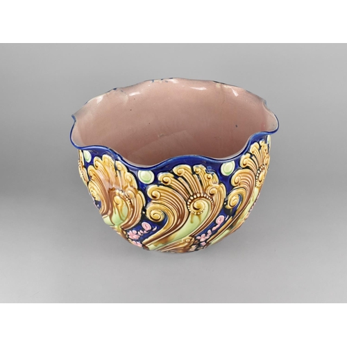 338 - A Large Majolica Jardiniere Decorated in Relief with Scrolls etc, 29cm high and 36cm Diameter (Some ... 