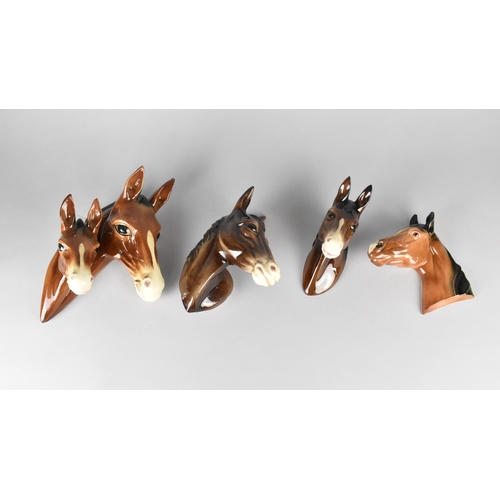 342 - A Collection of Four Various Glazed Ceramic Horse Wall Plaques