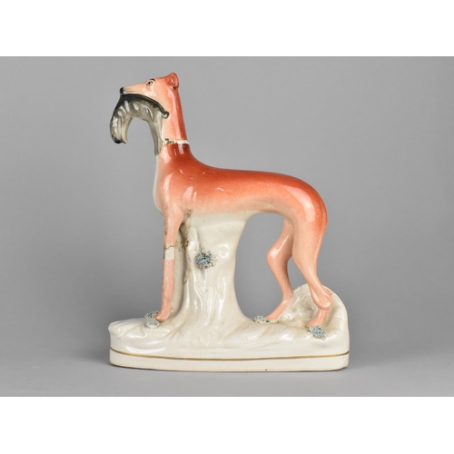 373 - A 19th Century Staffordshire Study of a Greyhound with Hare in Mouth, 29cms High, Condition Issues