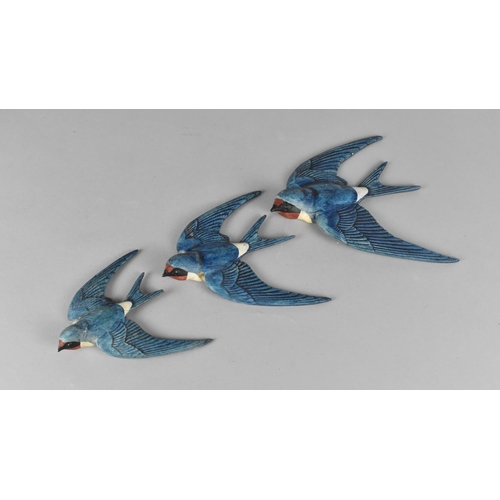 380 - A Set of Three Graduated Cold Painted Ceramic Swallow Wall Plaques, Inscribed to Back 'England' and ... 