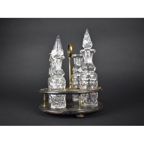 46 - A 19th Century Papier Mache Four Bottle Cruet Stand Containing Four Cut Glass Bottles, One with Silv... 